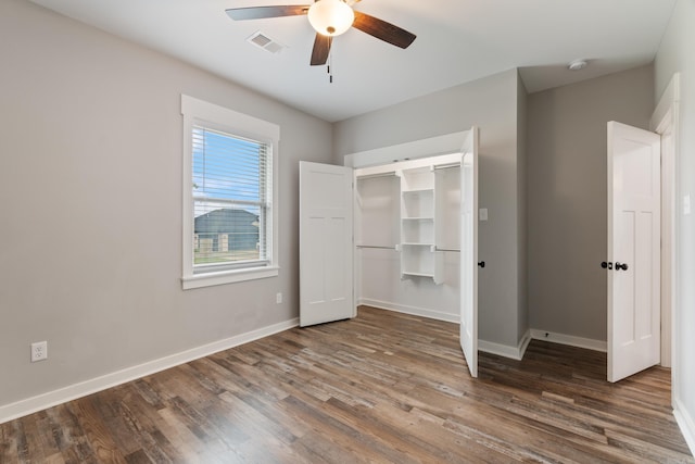 1569 Marquee Cir, Cabot, AR 72023 - unfurnished bedroom with wood finished floors, baseboards, a closet, and ceiling fan