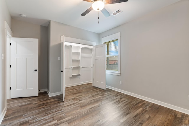 1569 Marquee Cir, Cabot, AR 72023 - unfurnished bedroom featuring wood finished floors, baseboards, a closet, and ceiling fan