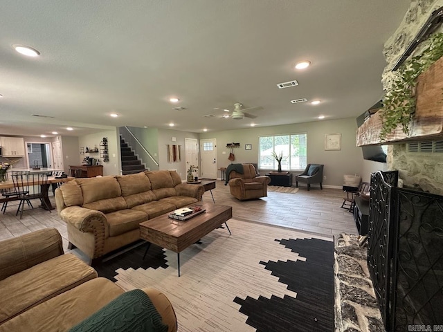 9 Whispering Dr, Alexander, AR 72002 - living room featuring stairway, recessed lighting, a ceiling fan, baseboards, and light wood-type flooring