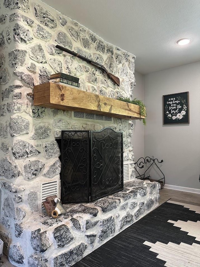 9 Whispering Dr, Alexander, AR 72002 - detailed view of a fireplace, baseboards, and wood finished floors