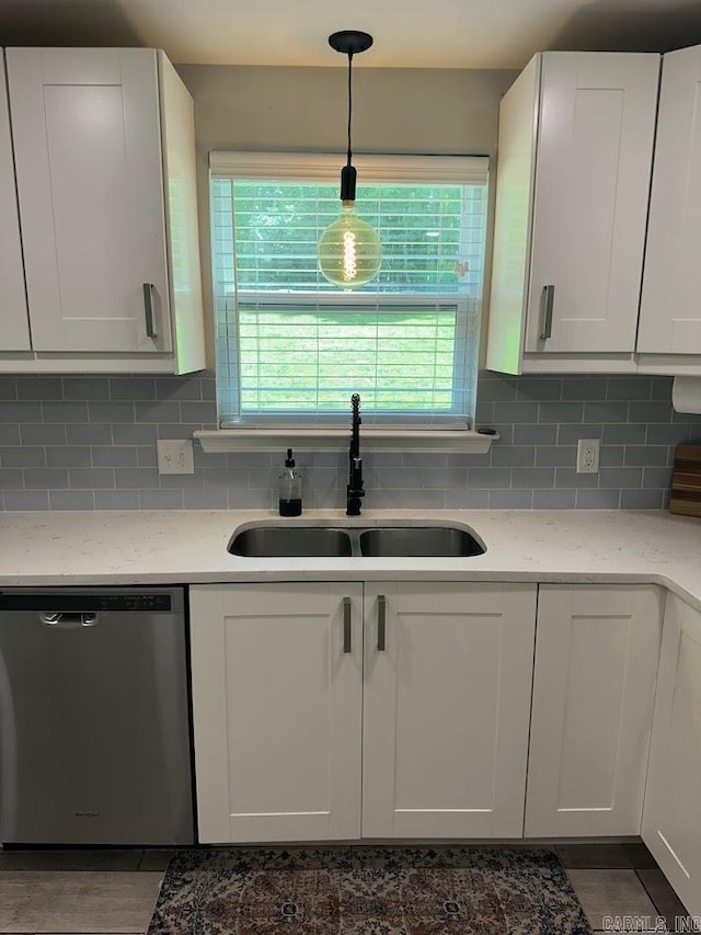 9 Whispering Dr, Alexander, AR 72002 - kitchen with dishwasher, a sink, backsplash, and white cabinets