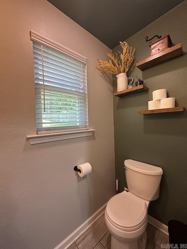 9 Whispering Dr, Alexander, AR 72002 - bathroom with toilet, baseboards, and wood finished floors