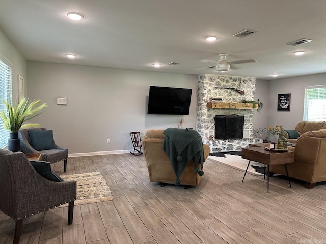 9 Whispering Dr, Alexander, AR 72002 - living room featuring light wood-type flooring, a ceiling fan, baseboards, a fireplace, and recessed lighting