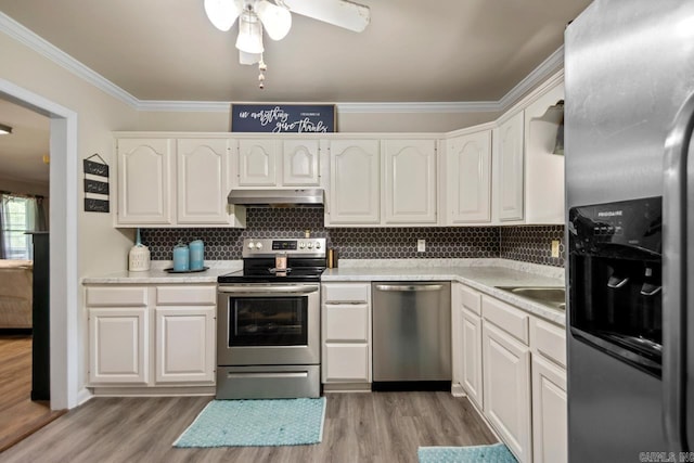 21 Evergreen Park, Cabot, AR 72023 - kitchen featuring stainless steel appliances, under cabinet range hood, crown molding, light wood finished floors, and white cabinets