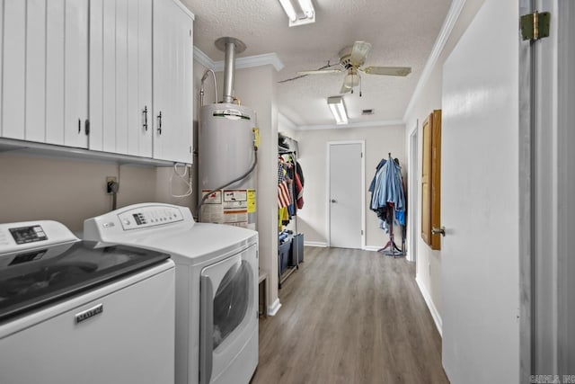 21 Evergreen Park, Cabot, AR 72023 - washroom featuring washer and dryer, a textured ceiling, water heater, a ceiling fan, and wood finished floors