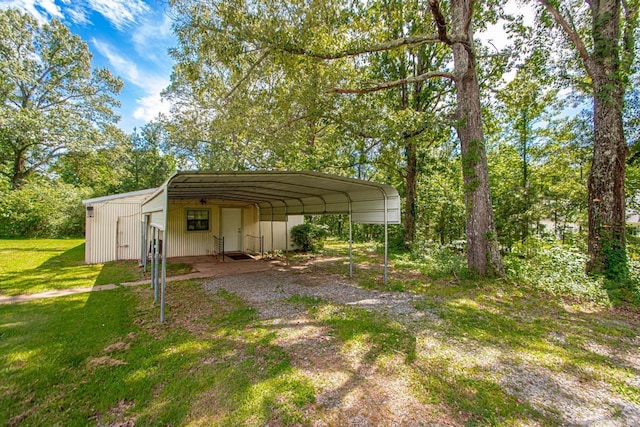 21 Evergreen Park, Cabot, AR 72023 - view of outbuilding with a detached carport and dirt driveway