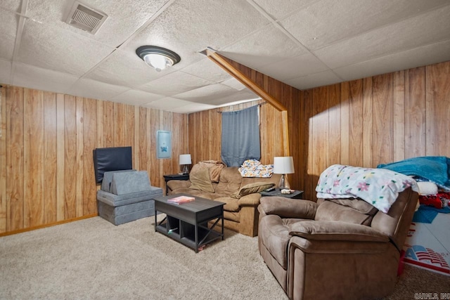 21 Evergreen Park, Cabot, AR 72023 - living room featuring a drop ceiling, wood walls, and carpet