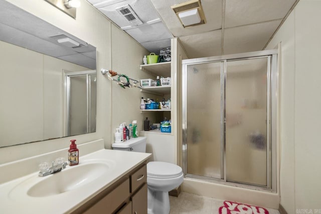 21 Evergreen Park, Cabot, AR 72023 - bathroom with vanity, a stall shower, toilet, tile patterned floors, and a paneled ceiling