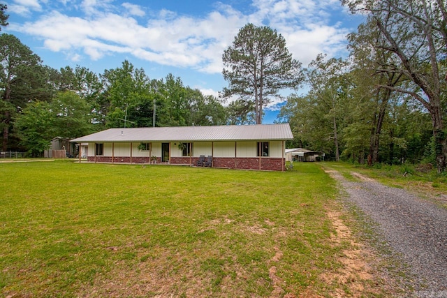 21 Evergreen Park, Cabot, AR 72023 - view of front of property featuring a front lawn, driveway, brick siding, and board and batten siding