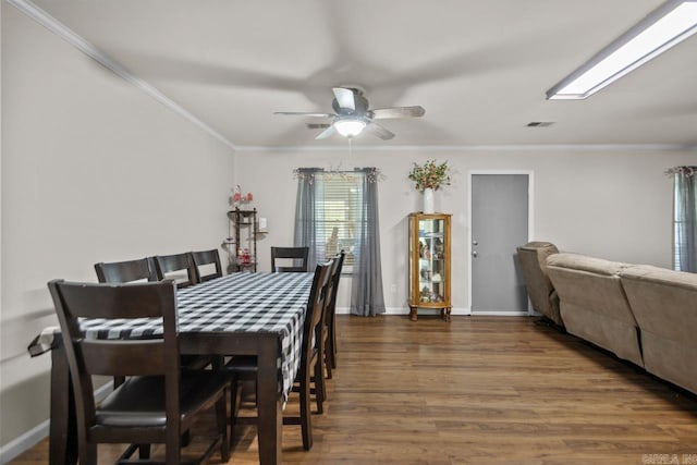 21 Evergreen Park, Cabot, AR 72023 - dining room featuring wood finished floors, a ceiling fan, ornamental molding, and baseboards