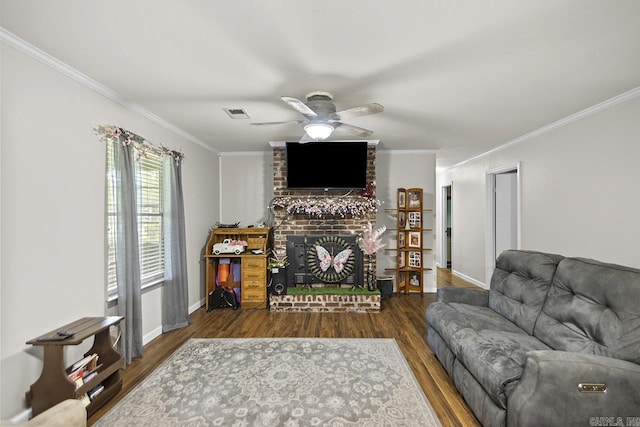 21 Evergreen Park, Cabot, AR 72023 - living room with crown molding, ceiling fan, wood finished floors, a fireplace, and baseboards