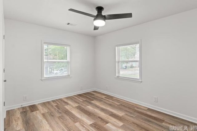 1506 N Pratt St, Pocahontas, AR 72455 - unfurnished room featuring wood finished floors, baseboards, and a ceiling fan