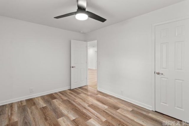 1506 N Pratt St, Pocahontas, AR 72455 - unfurnished bedroom featuring wood finished floors, baseboards, and ceiling fan