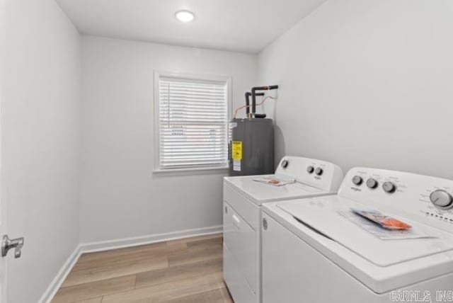 1506 N Pratt St, Pocahontas, AR 72455 - laundry area with washer and clothes dryer, water heater, baseboards, and light wood finished floors