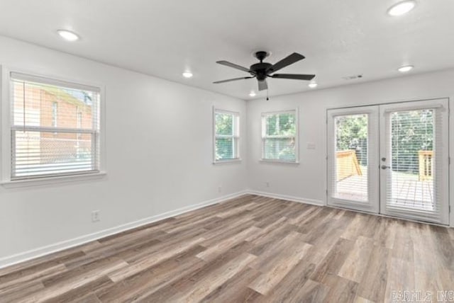 1506 N Pratt St, Pocahontas, AR 72455 - spare room featuring french doors, wood finished floors, recessed lighting, baseboards, and ceiling fan