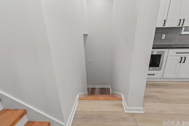1506 N Pratt St, Pocahontas, AR 72455 - staircase featuring wood finished floors and baseboards