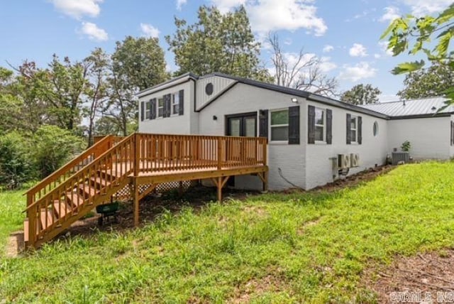 1506 N Pratt St, Pocahontas, AR 72455 - back of house with a wooden deck, central AC, a lawn, and stairs