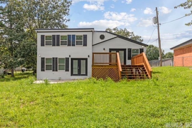 1506 N Pratt St, Pocahontas, AR 72455 - back of property with a wooden deck, french doors, stairway, and stucco siding