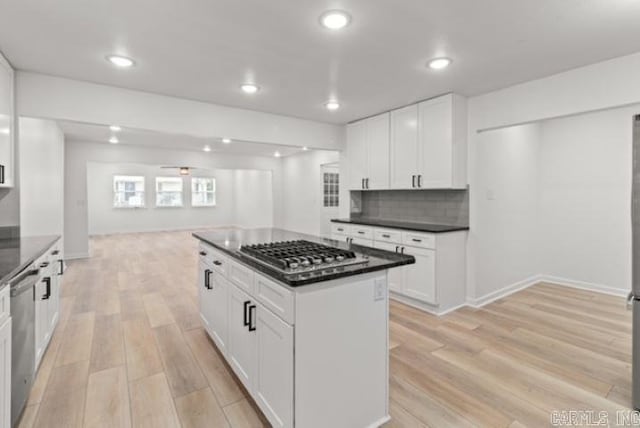 1506 N Pratt St, Pocahontas, AR 72455 - kitchen with stainless steel appliances, light wood-style floors, white cabinetry, decorative backsplash, and recessed lighting