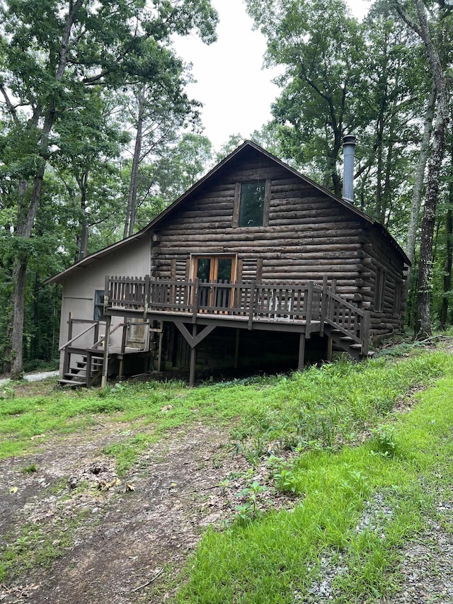 1203 Stewart Rd, Little Rock, AR 72223 - back of house featuring a wooden deck and log siding