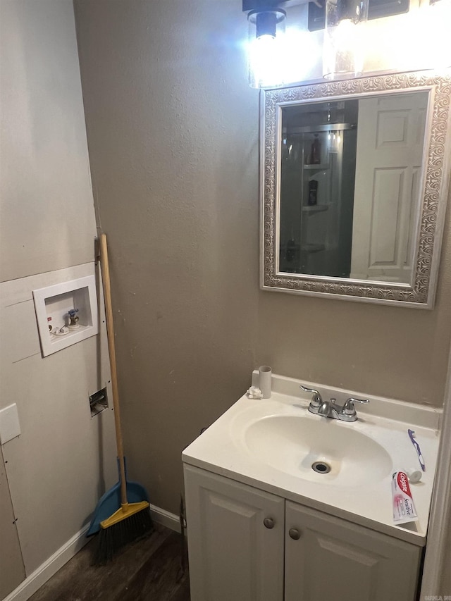 1203 Stewart Rd, Little Rock, AR 72223 - bathroom with vanity, wood finished floors, and baseboards