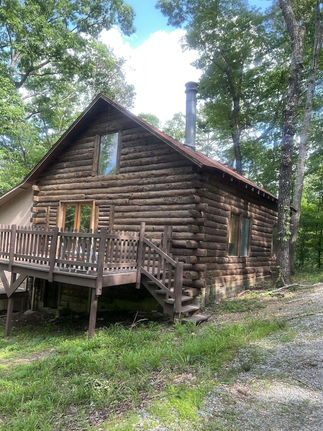 1203 Stewart Rd, Little Rock, AR 72223 - back of property with log exterior and a wooden deck