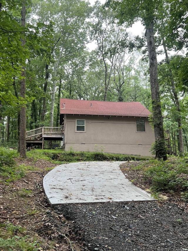 1203 Stewart Rd, Little Rock, AR 72223 - view of side of home with a deck, crawl space, and a shingled roof