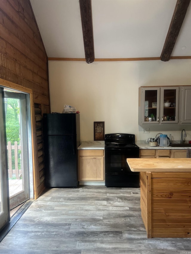 1203 Stewart Rd, Little Rock, AR 72223 - kitchen with black appliances, light wood finished floors, wooden counters, and glass insert cabinets