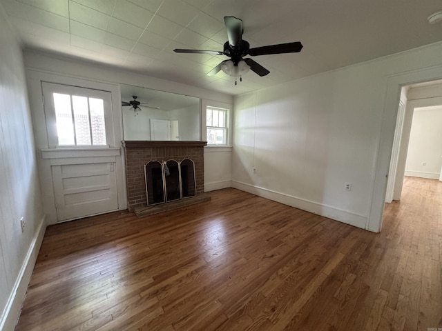 404 Mchenry, Malvern, AR 72104 - unfurnished living room with a fireplace, wood finished floors, and ceiling fan