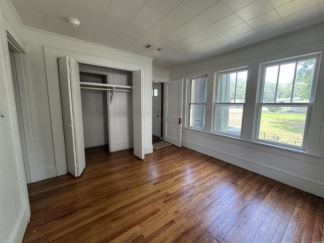 404 Mchenry, Malvern, AR 72104 - unfurnished bedroom featuring wood finished floors and a closet