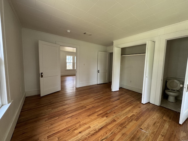 404 Mchenry, Malvern, AR 72104 - unfurnished bedroom with light wood-type flooring, ornamental molding, a closet, and baseboards