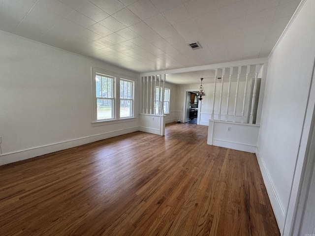 404 Mchenry, Malvern, AR 72104 - unfurnished room featuring dark wood-type flooring and baseboards