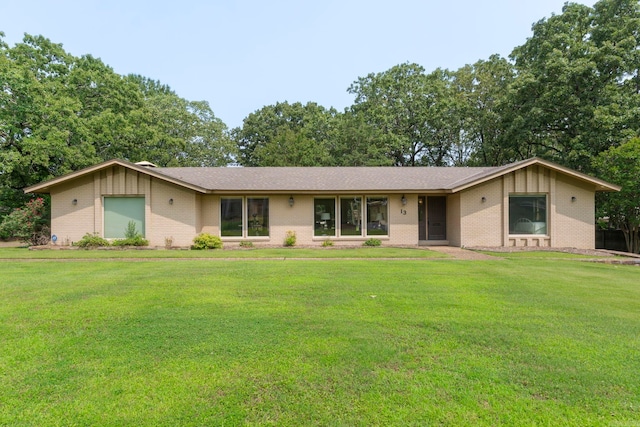 13 Heritage Park Cir, North Little Rock, AR 72116 - ranch-style home featuring brick siding, a front yard, and board and batten siding