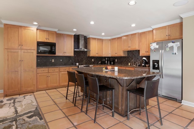 13 Heritage Park Cir, North Little Rock, AR 72116 - kitchen with stainless steel fridge, wall chimney exhaust hood, black microwave, a kitchen breakfast bar, and tasteful backsplash
