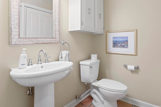13 Heritage Park Cir, North Little Rock, AR 72116 - half bathroom featuring baseboards, toilet, tile patterned flooring, and a sink