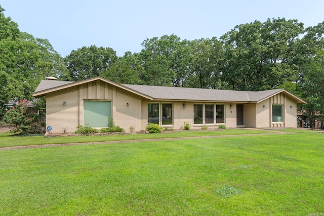 13 Heritage Park Cir, North Little Rock, AR 72116 - view of front of home with brick siding, a front lawn, and roof with shingles