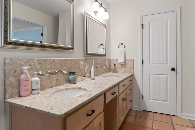 13 Heritage Park Cir, North Little Rock, AR 72116 - bathroom with double vanity, backsplash, tile patterned flooring, and baseboards