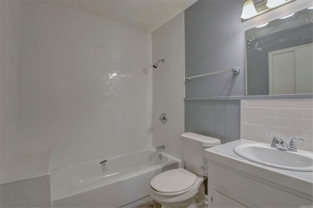 1320 Abigail St, Little Rock, AR 72204 - bathroom featuring toilet, shower / tub combination, vanity, and a wainscoted wall