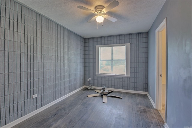1320 Abigail St, Little Rock, AR 72204 - unfurnished room with baseboards, wood finished floors, a textured ceiling, and ceiling fan