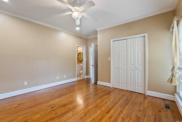 5 Cypress Pt, Little Rock, AR 72212 - unfurnished bedroom featuring crown molding, light wood-type flooring, baseboards, a closet, and a ceiling fan