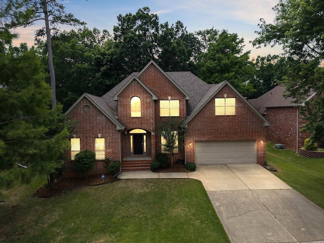 5 Cypress Pt, Little Rock, AR 72212 - traditional-style home featuring concrete driveway, a garage, brick siding, and a front lawn