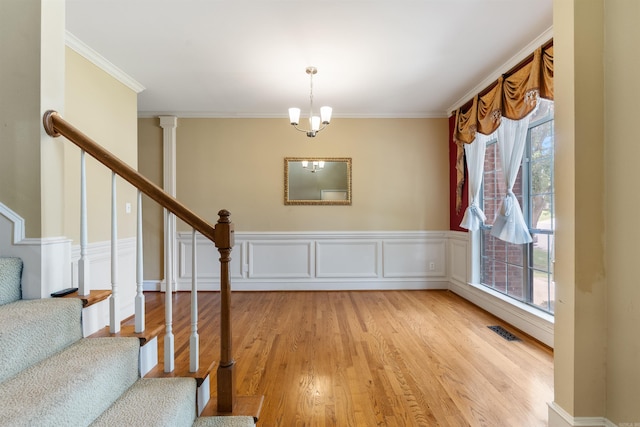5 Cypress Pt, Little Rock, AR 72212 - staircase with plenty of natural light, wood finished floors, ornamental molding, and wainscoting