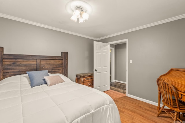15621 Mail Route Rd, Little Rock, AR 72206 - bedroom featuring wood finished floors, crown molding, and baseboards