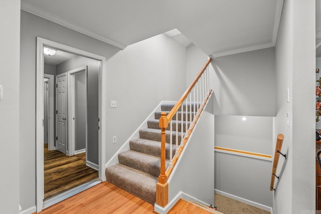 15621 Mail Route Rd, Little Rock, AR 72206 - stairs featuring crown molding, wood finished floors, and baseboards