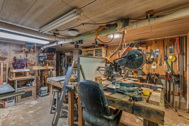 15621 Mail Route Rd, Little Rock, AR 72206 - below grade area with a workshop area and wooden walls