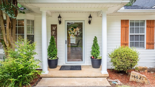 15621 Mail Route Rd, Little Rock, AR 72206 - property entrance with covered porch and roof with shingles