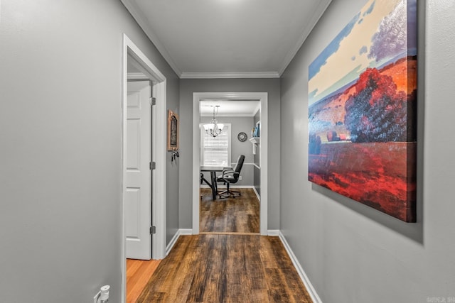 15621 Mail Route Rd, Little Rock, AR 72206 - hallway featuring wood finished floors, a chandelier, crown molding, and baseboards
