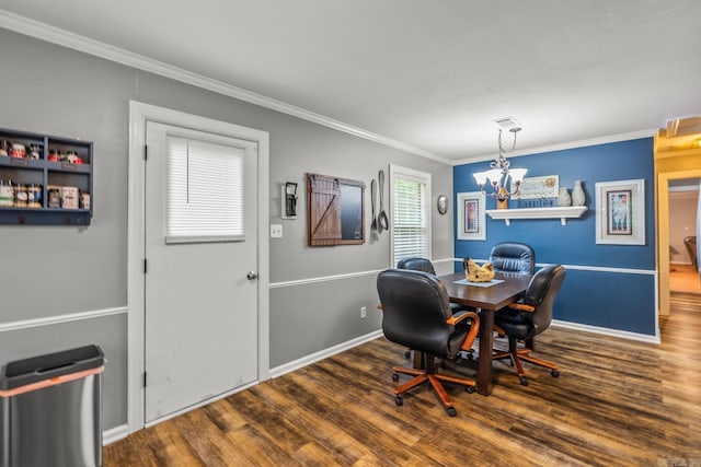 15621 Mail Route Rd, Little Rock, AR 72206 - dining space featuring crown molding, wood finished floors, baseboards, and a chandelier