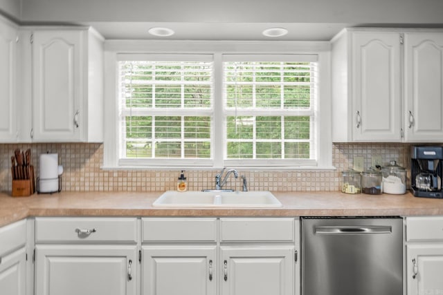15621 Mail Route Rd, Little Rock, AR 72206 - kitchen featuring stainless steel dishwasher, a sink, and white cabinets
