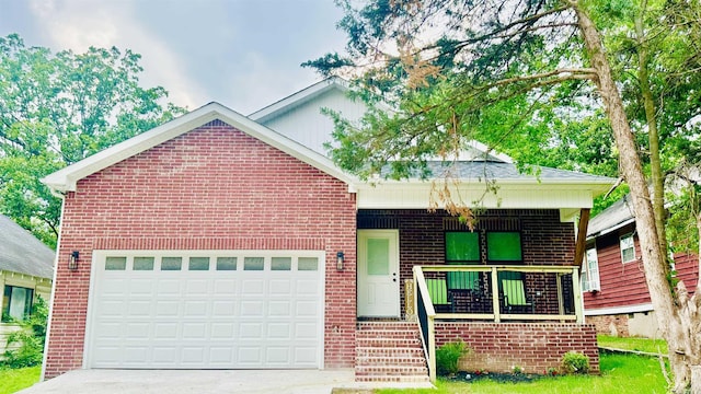 1418 S Martin St, Little Rock, AR 72204 - view of front facade featuring a porch, concrete driveway, an attached garage, and brick siding